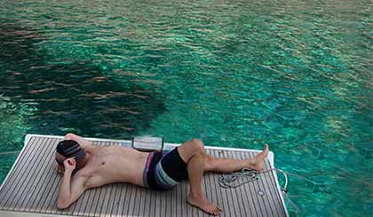 Relaxing on the boat during a freediving cruise
